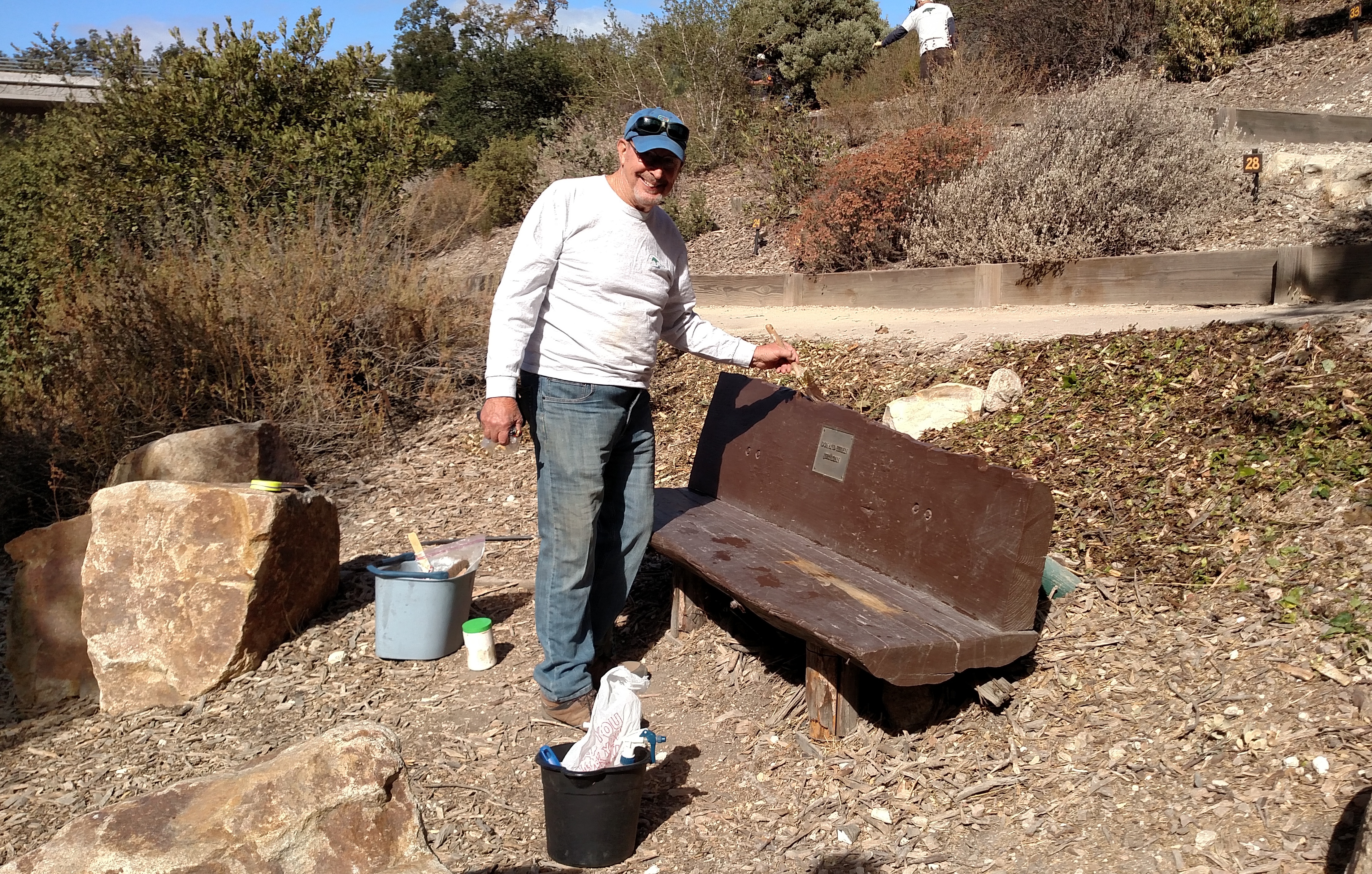 Clyde painting the benches!